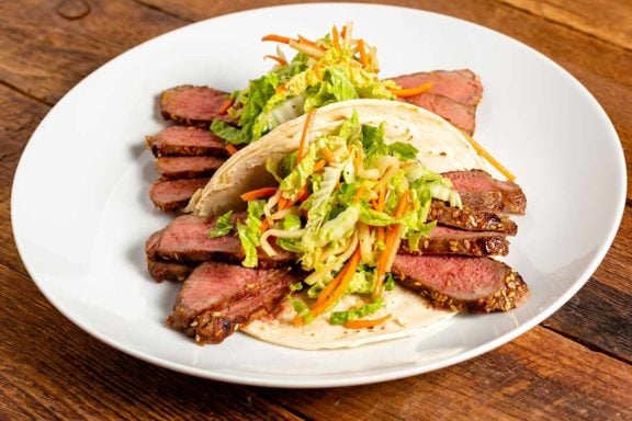 NY strip and cabbage slaw wrapped in a tortilla