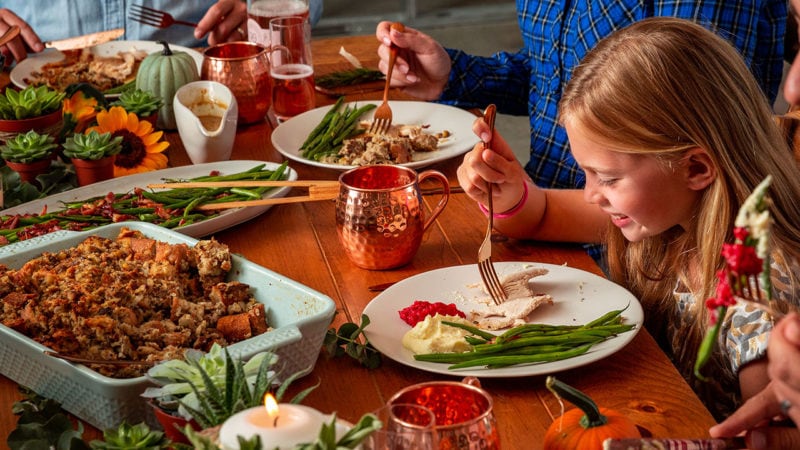 Cooking and eating thanksgiving dinner with kids.
