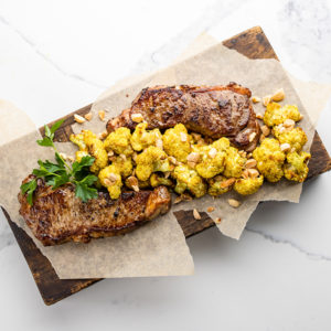 new york strip with almond roasted cauliflower