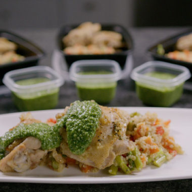 Lemon basil chicken thigh with quinoa and pesto plated as well in meal prep containers