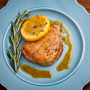 honey lemon pork chop on a plate