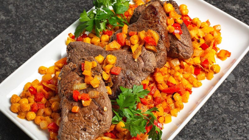 top sirloin steaks with cumin peppers and chickpeas