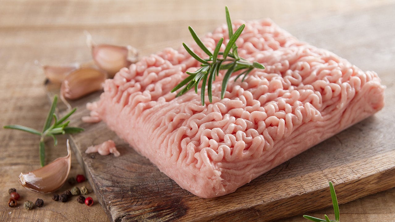 Raw ground turkey on a cutting board