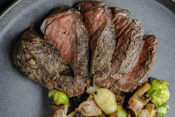 top sirloin steak with bacon and brussels sprout hash