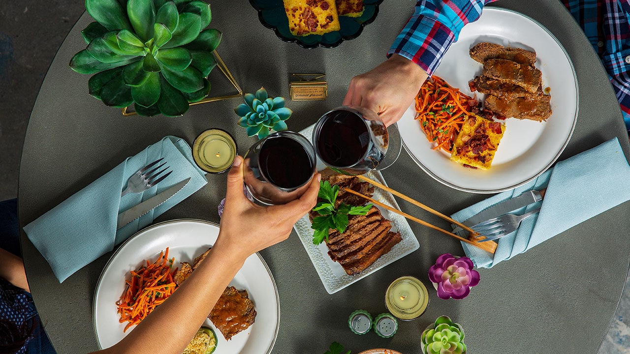 sharing a glass of wine at home dinner