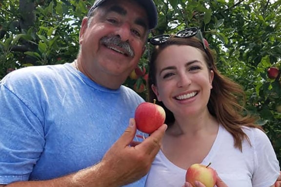 the author and dad eating apples