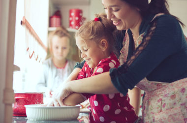 mom teaching kids to cook