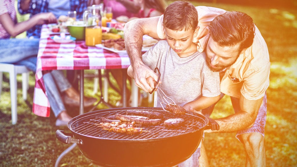 dad and son grilling