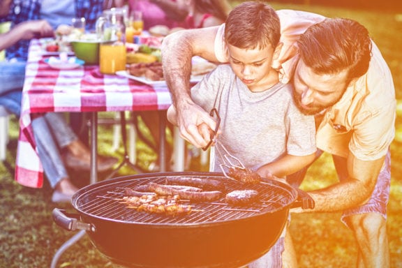 dad and son grilling