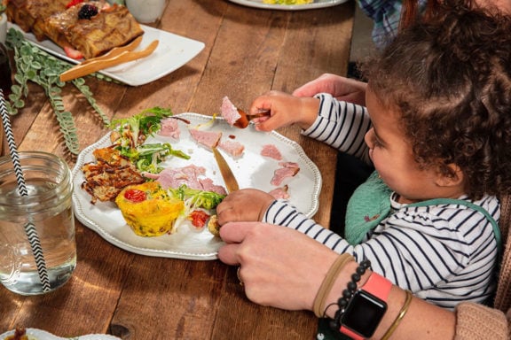 toddler eating frittata