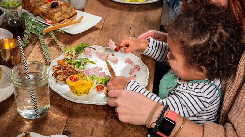 toddler eating frittata