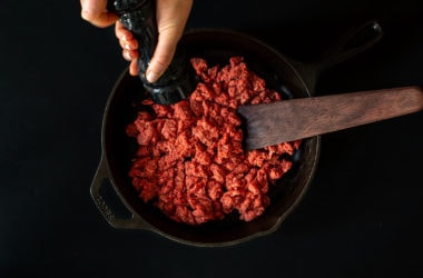 ground bison in cast iron pan