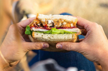 holding a sandwich with two hands