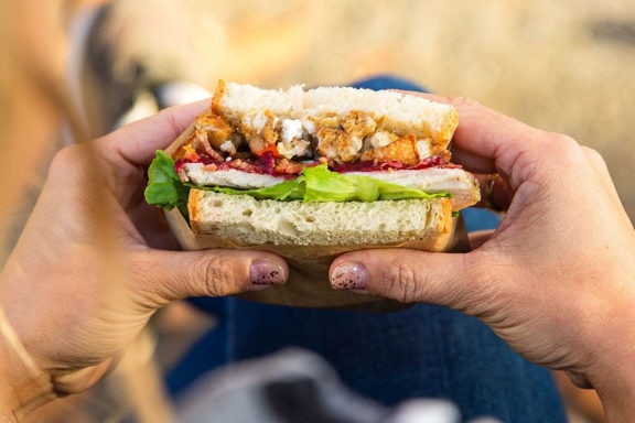 holding a sandwich with two hands