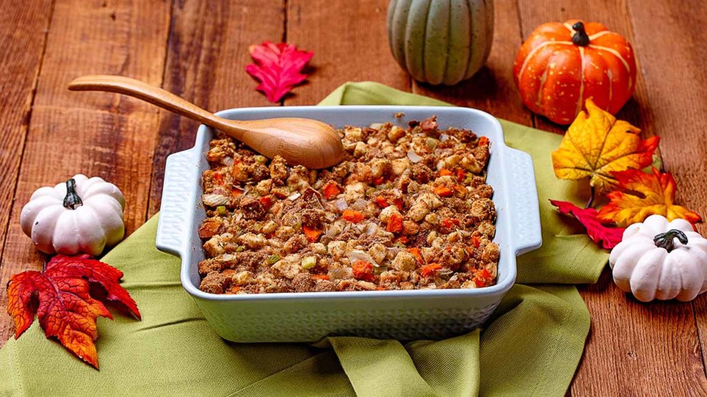 a festive fall table scape with a dish of stuffing