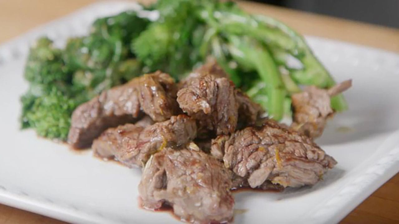 orange and rosemary marinated sirloin tips with broccoli rabe