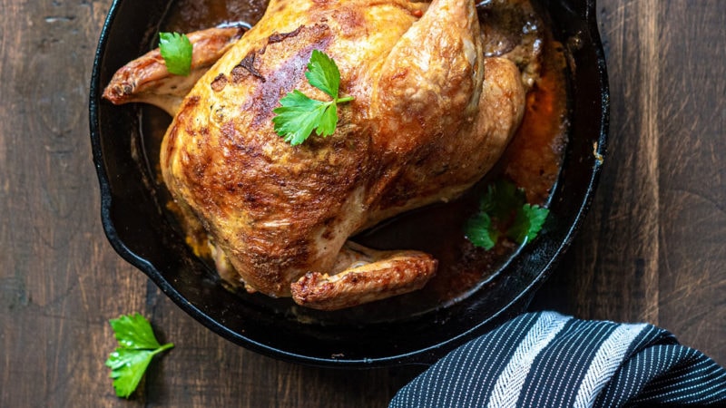 whole chicken in a cast-iron pan