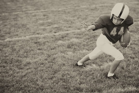 football playing kid