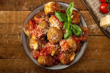 Chicken Parmesan meatballs stacked in a bowl
