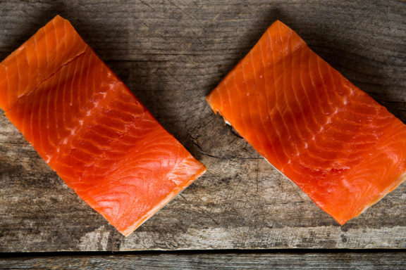 raw salmon on a wooden table