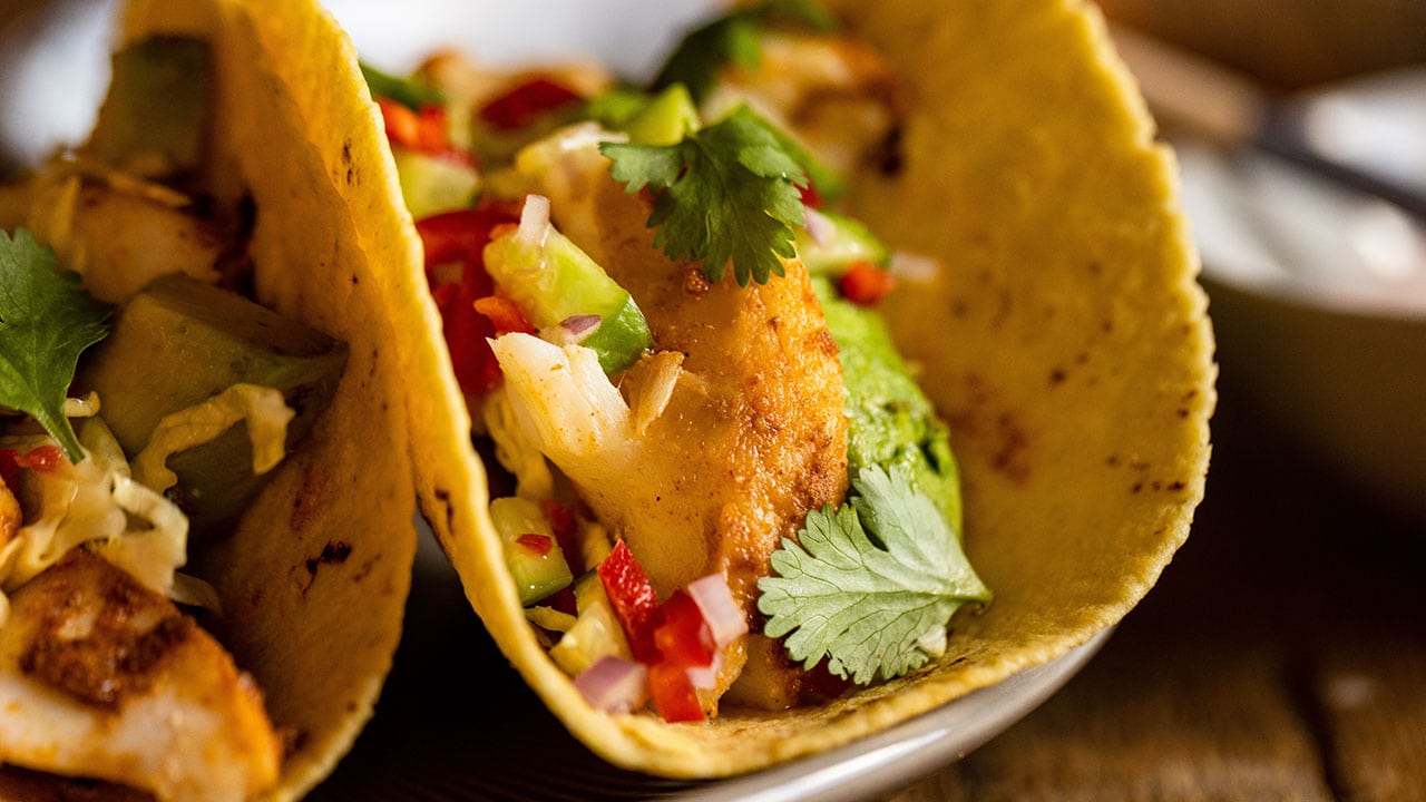 cod tacos with spicy crema and slaw