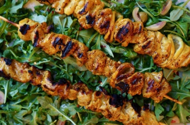 chicken thighs on skewers with lemons