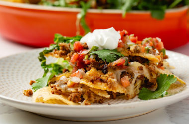 mexican-style chorizo crumbled in between layers of nachos