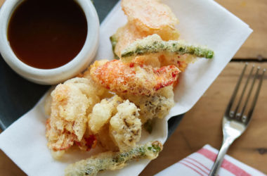 lobster and asparagus tempura next to a ponzu sauce