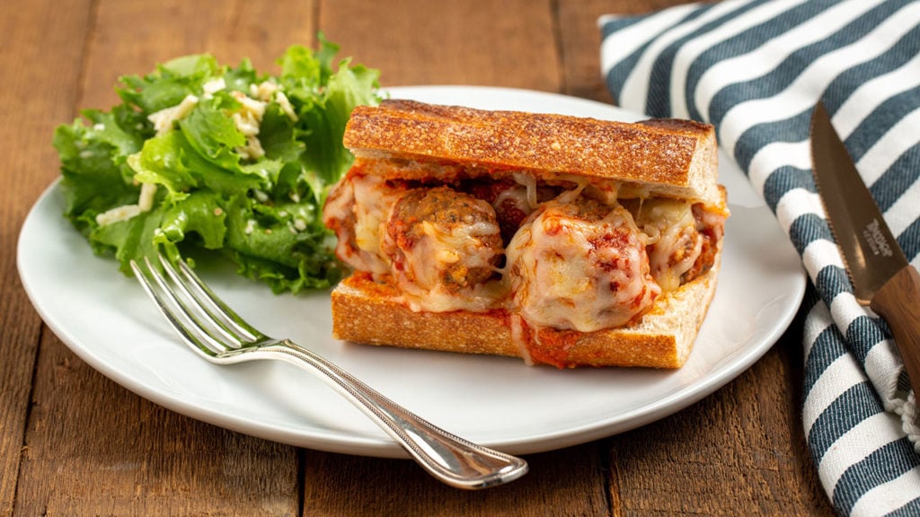meatball sandwich with caesar salad
