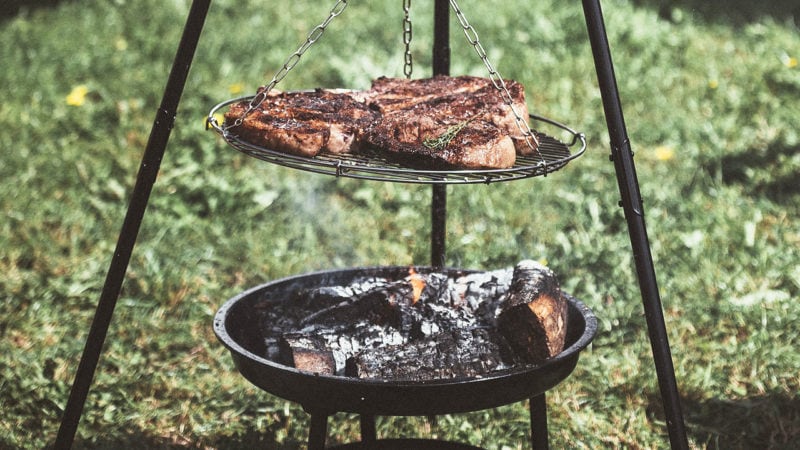 steak roasting over open fire