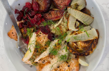 roasted chicken, fennel, cranberries, figs, and quinoa in a bowl