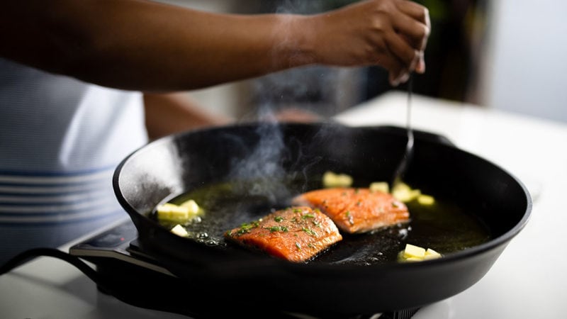 seafood in a cat iron pan with butter