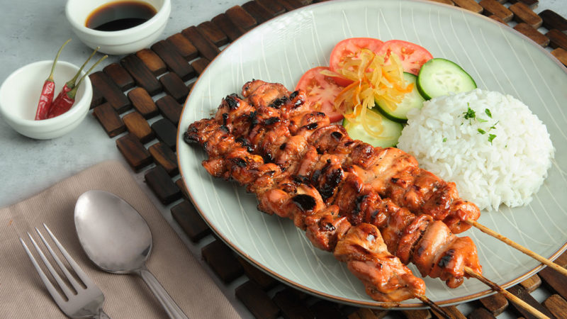 bbq filipino chicken skewers with rice and pickled green papaya