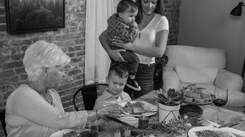 family sitting down at a table together