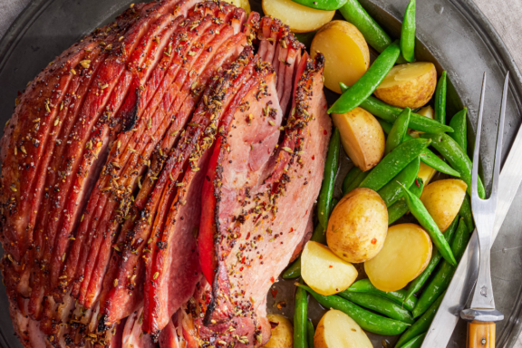 ham with snap peas and potatoes on a plate