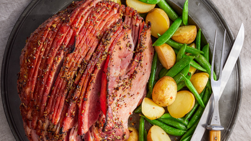 ham with snap peas and potatoes on a plate
