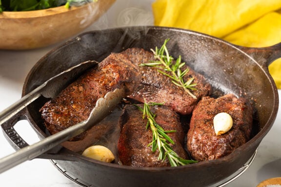 flat iron steak on a pan