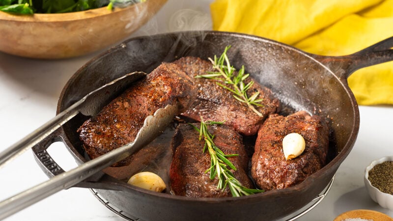 flat iron steak on a pan
