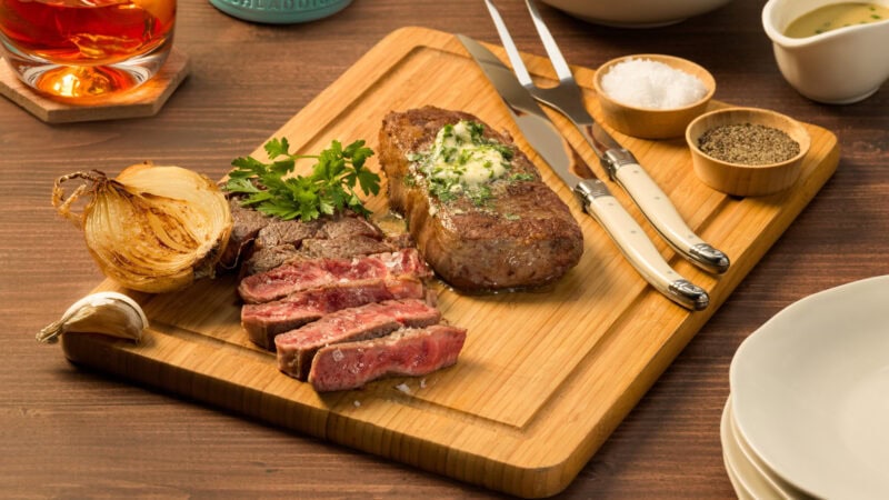 top sirlion steak in a chopping board